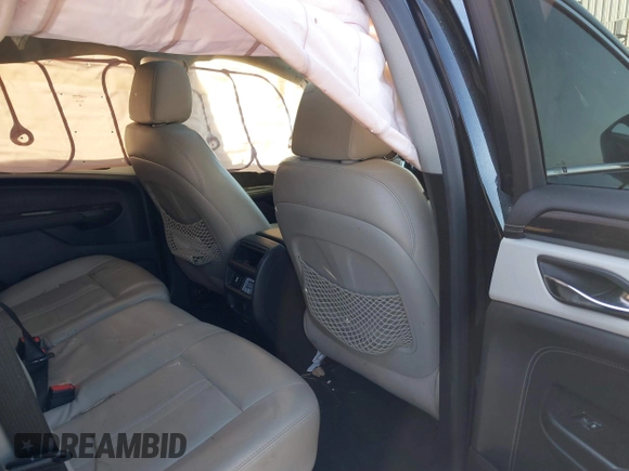2016 Cadillac SRX Luxury Collection with VIN 3GYFNBE31GS544322, listed as a IAAI auction lot 41855688 with 128,934 mi miles. Bid and sale history available at carsss.com. Image 8.