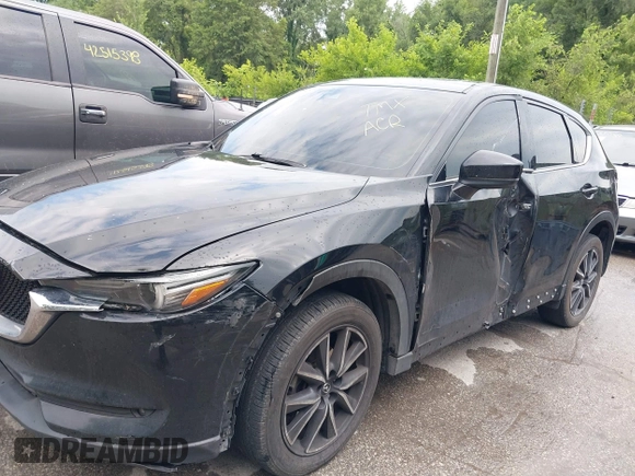 2018 Mazda CX-5 Grand Touring with VIN JM3KFBDM2J0400828, listed as a IAAI auction lot 42540846 with 254,672 mi miles and . Bid and sale history available at DreamBid. Image 6.