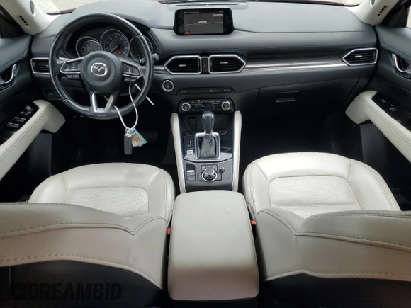2018 Mazda CX-5 Grand Touring with VIN JM3KFADM8J0444455, listed as a Copart auction lot 59793055 with 60,839 mi miles and Salvage title. Bid and sale history available at DreamBid. Image 8.
