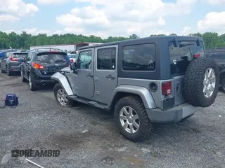 2014 Jeep Wrangler Unlimited Sahara z VIN 1C4BJWEG0EL129229, wystawiony jako IAAI lot #42380976 z przebiegiem 175 735 mil mil oraz . Historia ofert i sprzedaży dostępna na DreamBid. Obrazek 3.