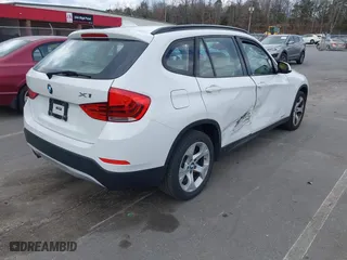 2015 BMW X1 sDrive28i with VIN WBAVM1C50FV314957, listed as a IAAI auction lot 41816402 with 148,410 mi miles. Bid and sale history available at carsss.com. Image 4.