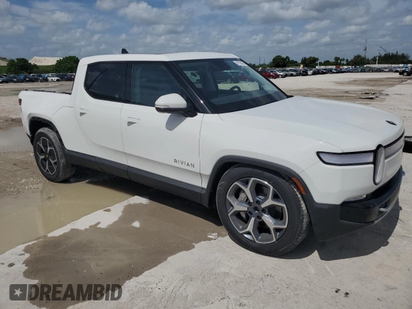 2023 Rivian R1T Adventure z VIN 7FCTGBAA5PN028668, wystawiony jako Copart lot #61126184 z przebiegiem 2337 mil mil oraz Szkody całkowita. Historia ofert i sprzedaży dostępna na DreamBid. Obrazek 4.