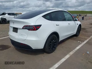 2022 Tesla Model Y Long Range with VIN 7SAYGDEE2NF403354, listed as a IAAI auction lot 41986216 with 53,177 mi miles and . Bid and sale history available at DreamBid. Image 4.