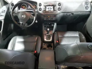 2013 Volkswagen Tiguan SE z VIN WVGBV3AX1DW579506, wystawiony jako Copart lot #52719575 z przebiegiem 163 471 mil mil oraz Szkoda całkowita • Salvage title. Historia ofert i sprzedaży dostępna na DreamBid. Obrazek 8.