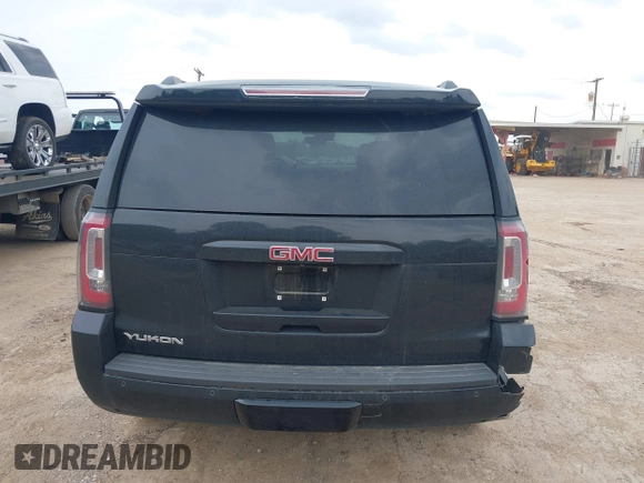 2015 GMC Yukon SLT with VIN 1GKS1BKC5FR274408, listed as a IAAI auction lot 41942157 with 165,978 mi miles. Bid and sale history available at carsss.com. Image 16.