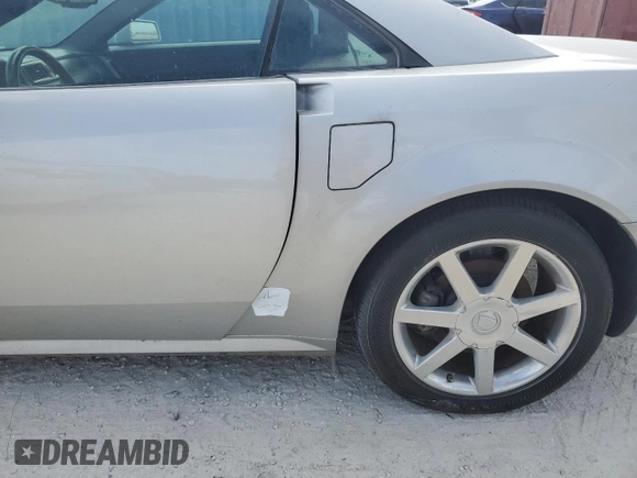 2004 Cadillac XLR z VIN 1G6YV34A945601007, wystawiony jako Copart lot #77077394 z przebiegiem Nie podano mil oraz Szkody całkowita. Historia ofert i sprzedaży dostępna na DreamBid. Obrazek 12.