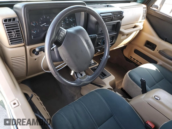 2000 Jeep Wrangler Sahara z VIN 1J4FA59S1YP746043, wystawiony jako Copart lot #58842665 z przebiegiem 148 348 mil mil oraz Szkoda całkowita • Salvage title. Historia ofert i sprzedaży dostępna na DreamBid. Obrazek 8.