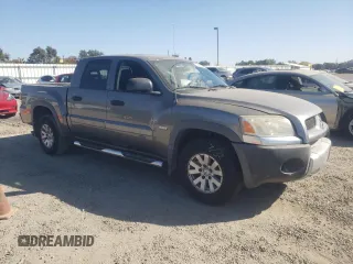 2006 Mitsubishi Raider Duro Cross z VIN 1Z7HC38K06S561639, wystawiony jako Copart lot #73588054 z przebiegiem 166 464 mil mil oraz Szkoda całkowita • Salvage title. Historia ofert i sprzedaży dostępna na DreamBid. Obrazek 4.