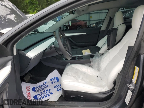 2023 Tesla Model 3 with VIN 5YJ3E1EA1PF678225, listed as a Copart auction lot 62634945 with 24,932 mi miles and Salvage title. Bid and sale history available at DreamBid. Image 7.