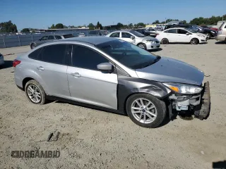 2018 Ford Focus SE with VIN 1FADP3FE4JL308909, listed as a Copart auction lot 61489005 with 58,613 mi miles and Salvage title. Bid and sale history available at DreamBid. Image 4.