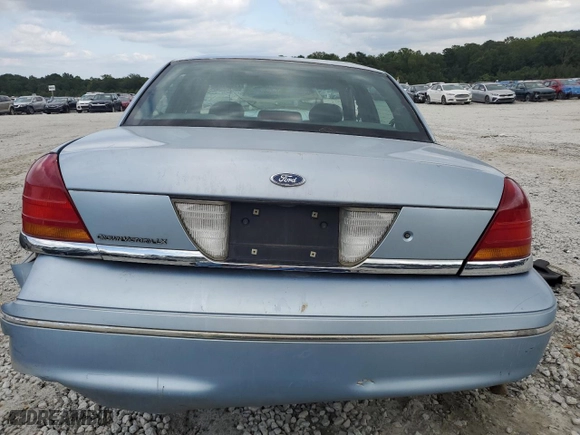 1999 Ford Crown Victoria LX with VIN 2FAFP74WXXX137154, listed as a Copart auction lot 71418784 with 97,589 mi miles and Salvage Title. Bid and sale history available at carsss.com. Image 6.