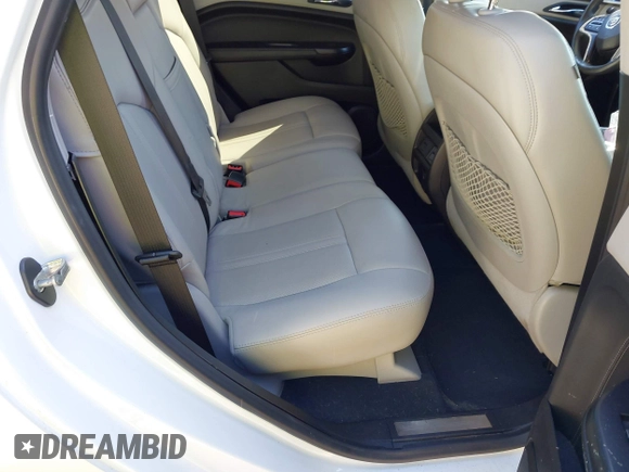 2014 Cadillac SRX Performance Collection with VIN 3GYFNFE30ES586713, listed as a IAAI auction lot 41791356 with 74,927 mi miles and . Bid and sale history available at DreamBid. Image 8.