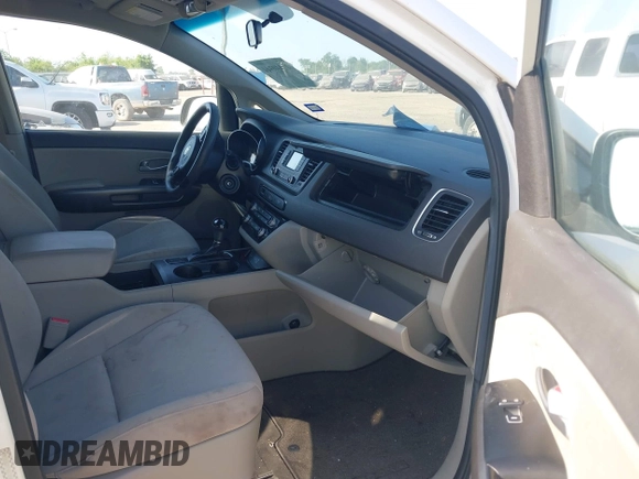 2015 Kia Sedona LX with VIN KNDMB5C10F6027850, listed as a IAAI auction lot 42010344 with 127,019 mi miles. Bid and sale history available at carsss.com. Image 5.