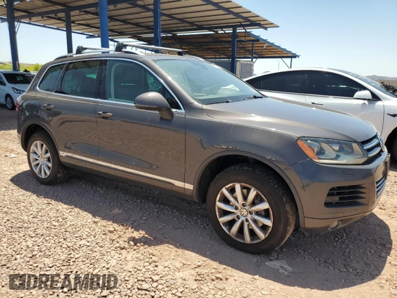 2012 Volkswagen Touareg Sport z VIN WVGFK9BPXCD003600, wystawiony jako Copart lot #61783705 z przebiegiem 171 598 mil mil oraz Czysty tytuł • Clean title. Historia ofert i sprzedaży dostępna na DreamBid. Obrazek 4.