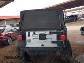 2006 Jeep Wrangler Sport with VIN 1J4FA49S46P748604, listed as a IAAI auction lot 41788157 with 128,249 mi miles. Bid and sale history available at carsss.com. Image 16.