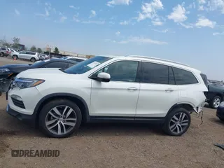 2017 Honda Pilot Touring with VIN 5FNYF5H95HB042632, listed as a IAAI auction lot 42011885 with 103,321 mi miles. Bid and sale history available at carsss.com. Image 15.