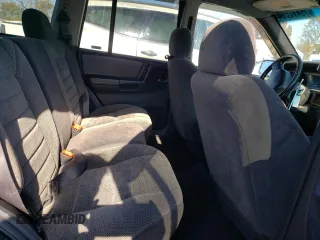 1998 Jeep Grand Cherokee Laredo with VIN 1J4GZ58S8WC167716, listed as a Copart auction lot 76477694 with 167,519 mi miles and Salvage Title. Bid and sale history available at carsss.com. Image 11.