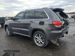 2015 Jeep Grand Cherokee Summit with VIN 1C4RJFJM7FC928257, listed as a Copart auction lot 82525714 with 148,208 mi miles and Salvage Title. Bid and sale history available at carsss.com. Image 2.