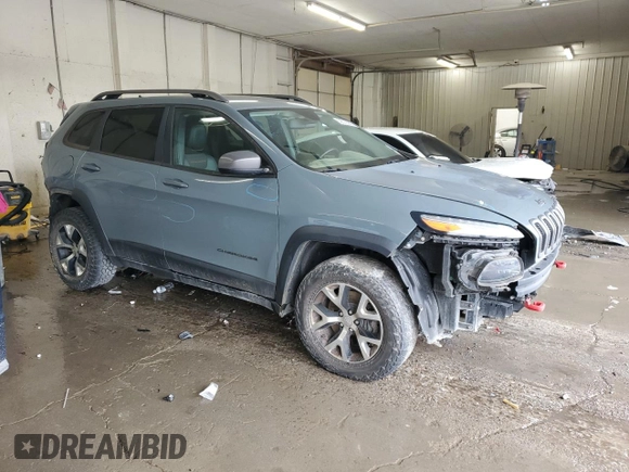 2014 Jeep Cherokee Trailhawk z VIN 1C4PJMBB0EW309277, wystawiony jako Copart lot #52370565 z przebiegiem 148 924 mil mil oraz Czysty tytuł • Clean title. Historia ofert i sprzedaży dostępna na DreamBid. Obrazek 4.