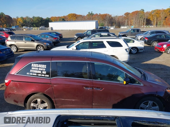 2012 Honda Odyssey Touring with VIN 5FNRL5H9XCB067841, listed as a IAAI auction lot 40631672 with 210,237 mi miles and . Bid and sale history available at DreamBid. Image 14.