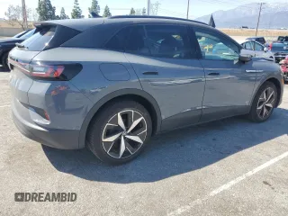 2023 Volkswagen ID.4 Pro with VIN 1V2VMPE86PC042164, listed as a Copart auction lot 50260215 with 4,328 mi miles and Clean Title. Bid and sale history available at DreamBid. Image 3.