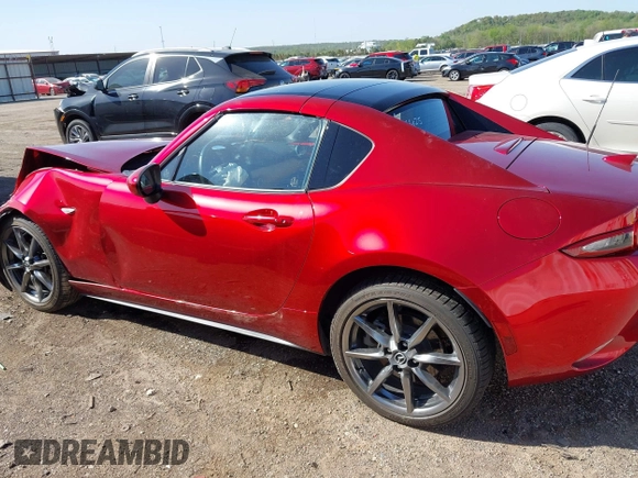 2020 Mazda MX-5 Miata Grand Touring z VIN JM1NDAM77L0418499, wystawiony jako IAAI lot #42010802 z przebiegiem 19 588 mil mil oraz . Historia ofert i sprzedaży dostępna na DreamBid. Obrazek 14.
