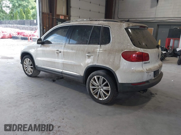2012 Volkswagen Tiguan SE with VIN WVGAV7AXXCW533237, listed as a IAAI auction lot 42670923 with 227,323 mi miles and . Bid and sale history available at DreamBid. Image 3.