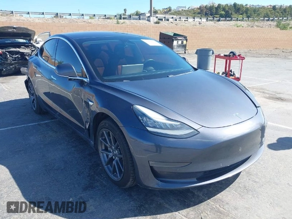 2019 Tesla Model 3 Mid Range with VIN 5YJ3E1EA6KF307456, listed as a IAAI auction lot 41944454 with 99,059 mi miles and . Bid and sale history available at DreamBid. Image 1.