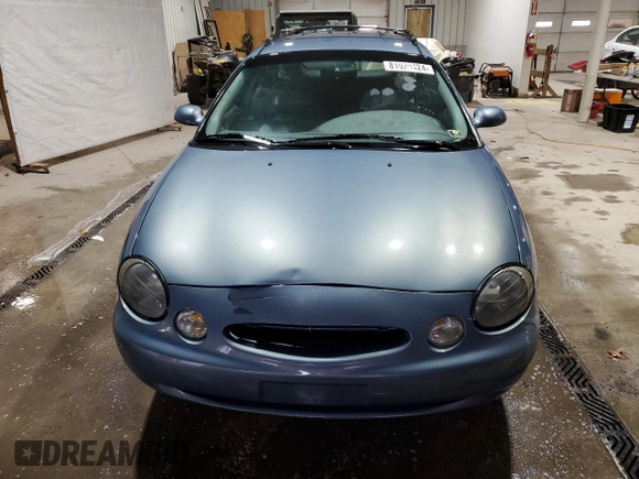1999 Ford Taurus SE z VIN 1FAFP58S0XG301691, wystawiony jako Copart lot #81920424 z przebiegiem 203 931 mil mil oraz Szkoda całkowita • Salvage title. Historia ofert i sprzedaży dostępna na DreamBid. Obrazek 5.