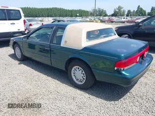 1995 Mercury Cougar z VIN 1MELM62W5SH606001, wystawiony jako IAAI lot #42461451 z przebiegiem 83 279 mil mil oraz . Historia ofert i sprzedaży dostępna na DreamBid. Obrazek 3.