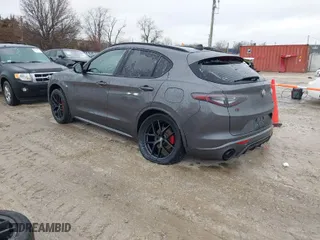 2021 Alfa Romeo Stelvio Ti with VIN ZASPAKBN9M7D18770, listed as a IAAI auction lot 41520181 with 64,709 mi miles. Bid and sale history available at carsss.com. Image 3.