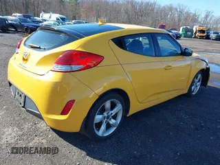 2012 Hyundai Veloster w/Black Int with VIN KMHTC6ADXCU042788, listed as a IAAI auction lot 41854662 with 90,500 mi miles. Bid and sale history available at carsss.com. Image 4.