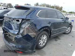 2016 Mazda CX-9 Sport with VIN JM3TCABY3G0123239, listed as a IAAI auction lot 42570700 with 119,414 mi miles and . Bid and sale history available at DreamBid. Image 4.