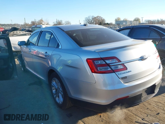 2014 Ford Taurus SEL z VIN 1FAHP2E87EG121069, wystawiony jako IAAI lot #41030422 z przebiegiem 138 043 mil mil oraz . Historia ofert i sprzedaży dostępna na DreamBid. Obrazek 3.