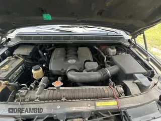 2005 Nissan Armada LE z VIN 5N1AA08A45N703735, wystawiony jako Copart lot #59034285 z przebiegiem 242 012 mil mil oraz Tytuł czysty. Historia ofert i sprzedaży dostępna na DreamBid. Obrazek 7.