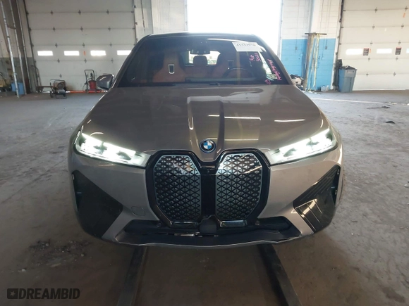 2023 BMW iX xDrive50 with VIN WB523CF08PCM10011, listed as a IAAI auction lot 41332976 with 19,013 mi miles. Bid and sale history available at carsss.com. Image 12.