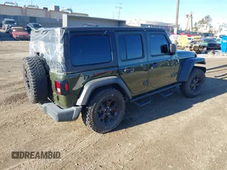 2022 Jeep Wrangler Unlimited High Tide with VIN 1C4HJXDG5NW113205, listed as a IAAI auction lot 41488724 with 30,446 mi miles and . Bid and sale history available at DreamBid. Image 4.