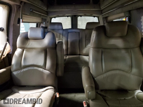 2002 Chevrolet Express z VIN 1GBFG15R921215686, wystawiony jako Copart lot #75614424 z przebiegiem Nie podano mil oraz Szkody całkowita. Historia ofert i sprzedaży dostępna na DreamBid. Obrazek 10.
