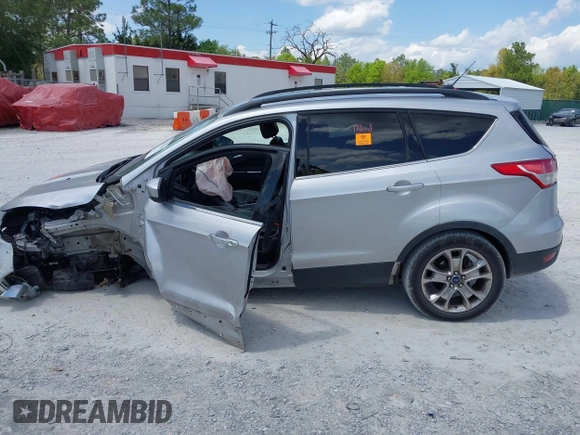 2016 Ford Escape SE with VIN 1FMCU9G92GUC28879, listed as a IAAI auction lot 42021065 with 99,184 mi miles. Bid and sale history available at carsss.com. Image 14.