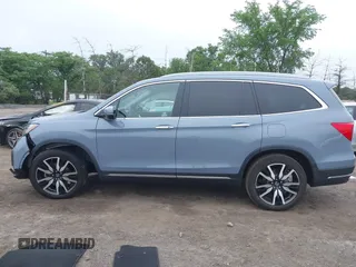 2022 Honda Pilot Touring 7-Passenger with VIN 5FNYF6H68NB056077, listed as a IAAI auction lot 42357338 with 18,193 mi miles and . Bid and sale history available at DreamBid. Image 14.