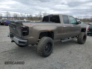 2014 Chevrolet Silverado 1500 LTZ with VIN 1GCVKSEC0EZ140325, listed as a Copart auction lot 52954845 with 128,231 mi miles and Salvage Title. Bid and sale history available at DreamBid. Image 3.