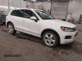 2013 Volkswagen Touareg Lux with VIN WVGEF9BP5DD011511, listed as a IAAI auction lot 41608840 with 167,350 mi miles and . Bid and sale history available at DreamBid. Image 1.
