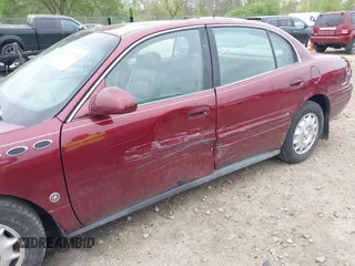 2001 Buick LeSabre Limited z VIN 1G4HR54K41U100044, wystawiony jako IAAI lot #42215795 z przebiegiem 125 144 mil mil oraz . Historia ofert i sprzedaży dostępna na DreamBid. Obrazek 6.