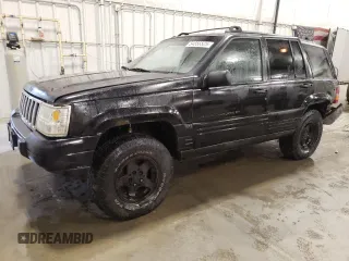 1997 Jeep Grand Cherokee Laredo z VIN 1J4GZ58S3VC508180, wystawiony jako Copart lot #54856525 z przebiegiem 214 845 mil mil oraz Nie do naprawy • Non repairable. Historia ofert i sprzedaży dostępna na DreamBid. Obrazek 1.