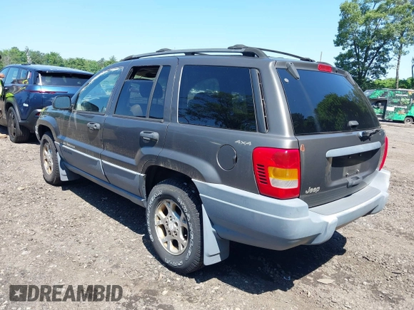 2000 Jeep Grand Cherokee Laredo with VIN 1J4GW48S8YC380039, listed as a IAAI auction lot 42510307 with 215,776 mi miles and . Bid and sale history available at DreamBid. Image 3.