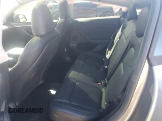 2025 Tesla Model Y Long Range with VIN 7SAYGDED0SF247561, listed as a Copart auction lot 50736875 with 9,094 mi miles and Salvage Title. Bid and sale history available at DreamBid. Image 10.