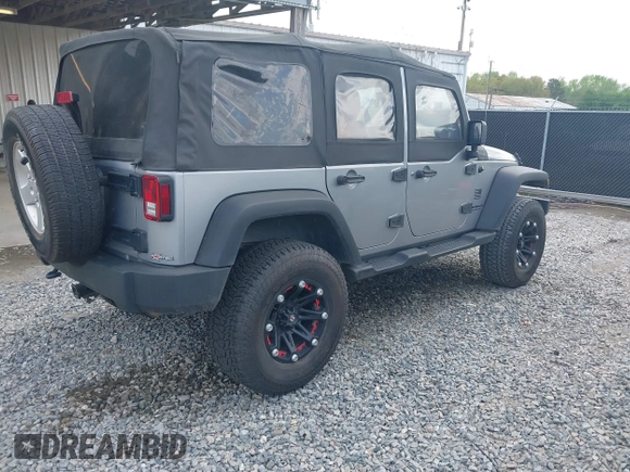 2014 Jeep Wrangler Unlimited Sport with VIN 1C4BJWDG3EL135351, listed as a IAAI auction lot 41947408 with 104,460 mi miles. Bid and sale history available at carsss.com. Image 4.