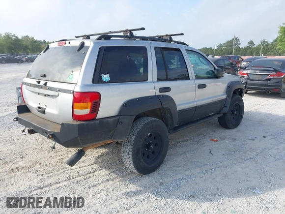 2003 Jeep Grand Cherokee Laredo z VIN 1J8GW48S33C519680, wystawiony jako IAAI lot #42126714 z przebiegiem 295 517 mil mil oraz . Historia ofert i sprzedaży dostępna na DreamBid. Obrazek 4.