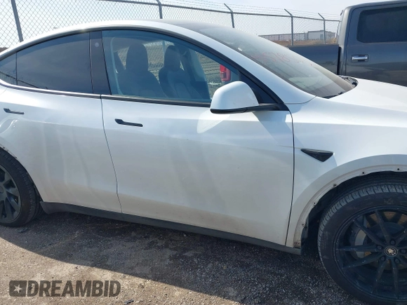 2022 Tesla Model Y Long Range with VIN 7SAYGDEE4NF428434, listed as a IAAI auction lot 41578503 with 35,460 mi miles and . Bid and sale history available at DreamBid. Image 13.