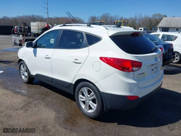 2013 Hyundai Tucson GLS with VIN KM8JU3AC6DU646866, listed as a IAAI auction lot 41846665 with 156,779 mi miles. Bid and sale history available at carsss.com. Image 3.